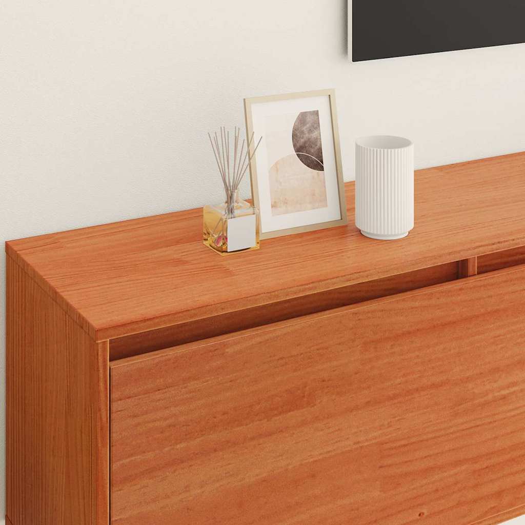 a close-up of the top surface of the wall cabinet with a diffuser and a picture frame