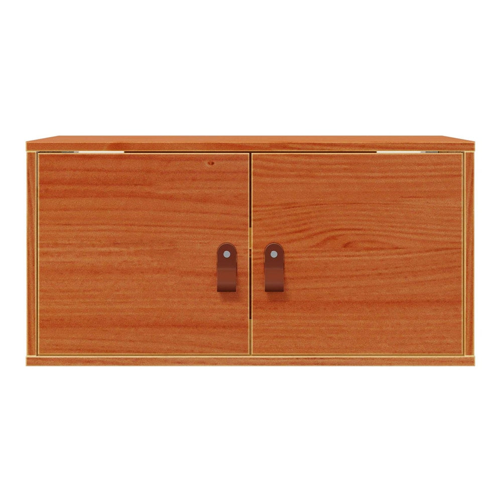 A close-up of the wall cabinet, showing the wood grain and the closed doors