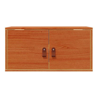 A close-up of the wall cabinet, showing the wood grain and the closed doors
