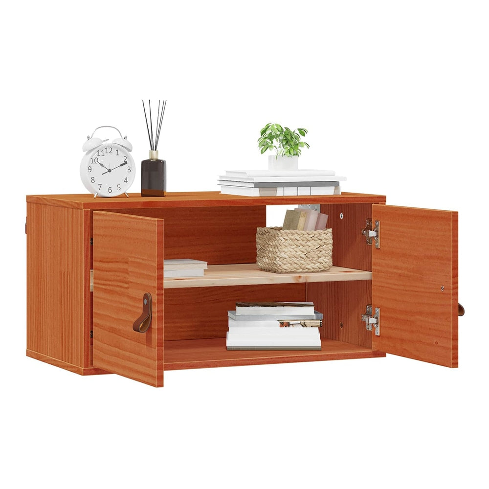 The wall cabinet with doors open, displaying books and decorative items on its shelves