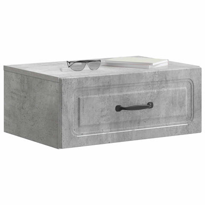 The bedside table with a pair of glasses and a book placed on the top surface