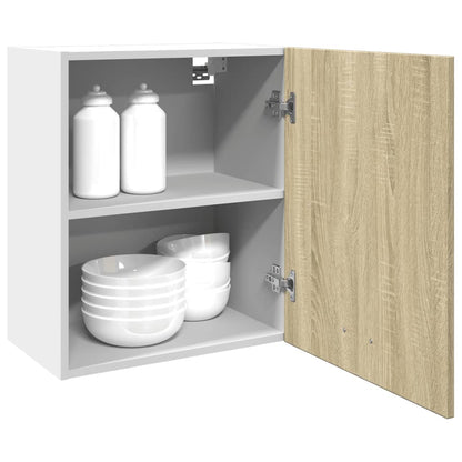 Open kitchen cabinet showing two shelves and white bowls