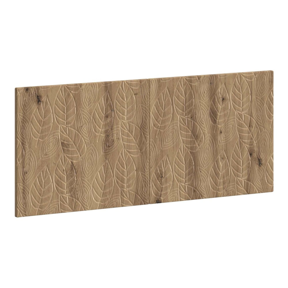 The wall-mounted headboard with a carved leaf pattern in artisan oak effect