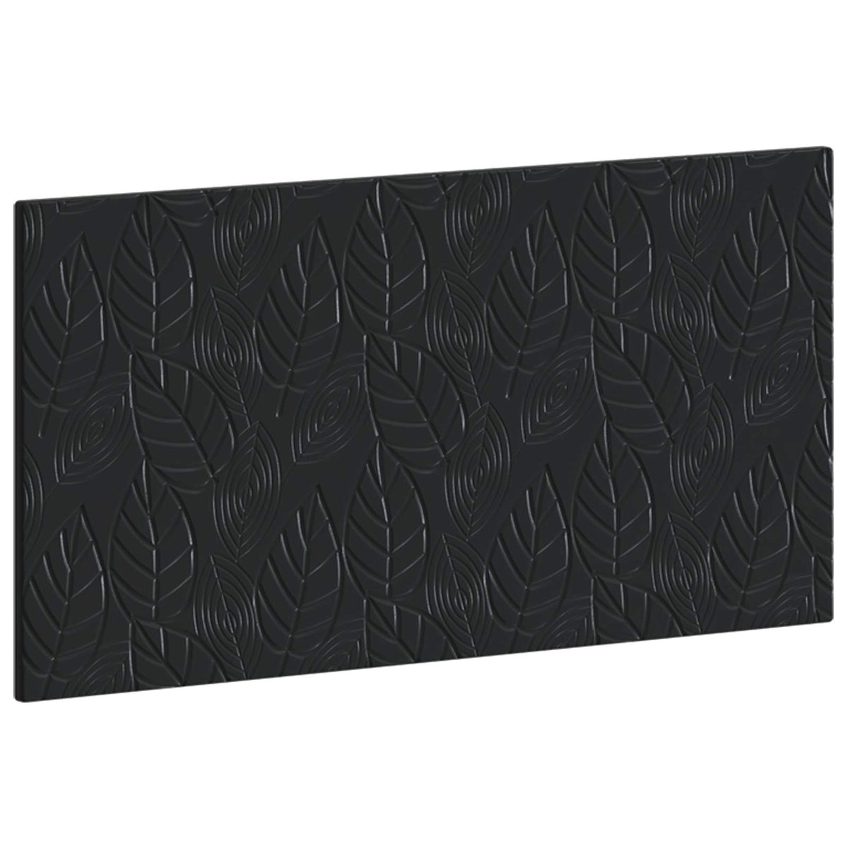 The black headboard with a textured leaf pattern seen from a slight angle