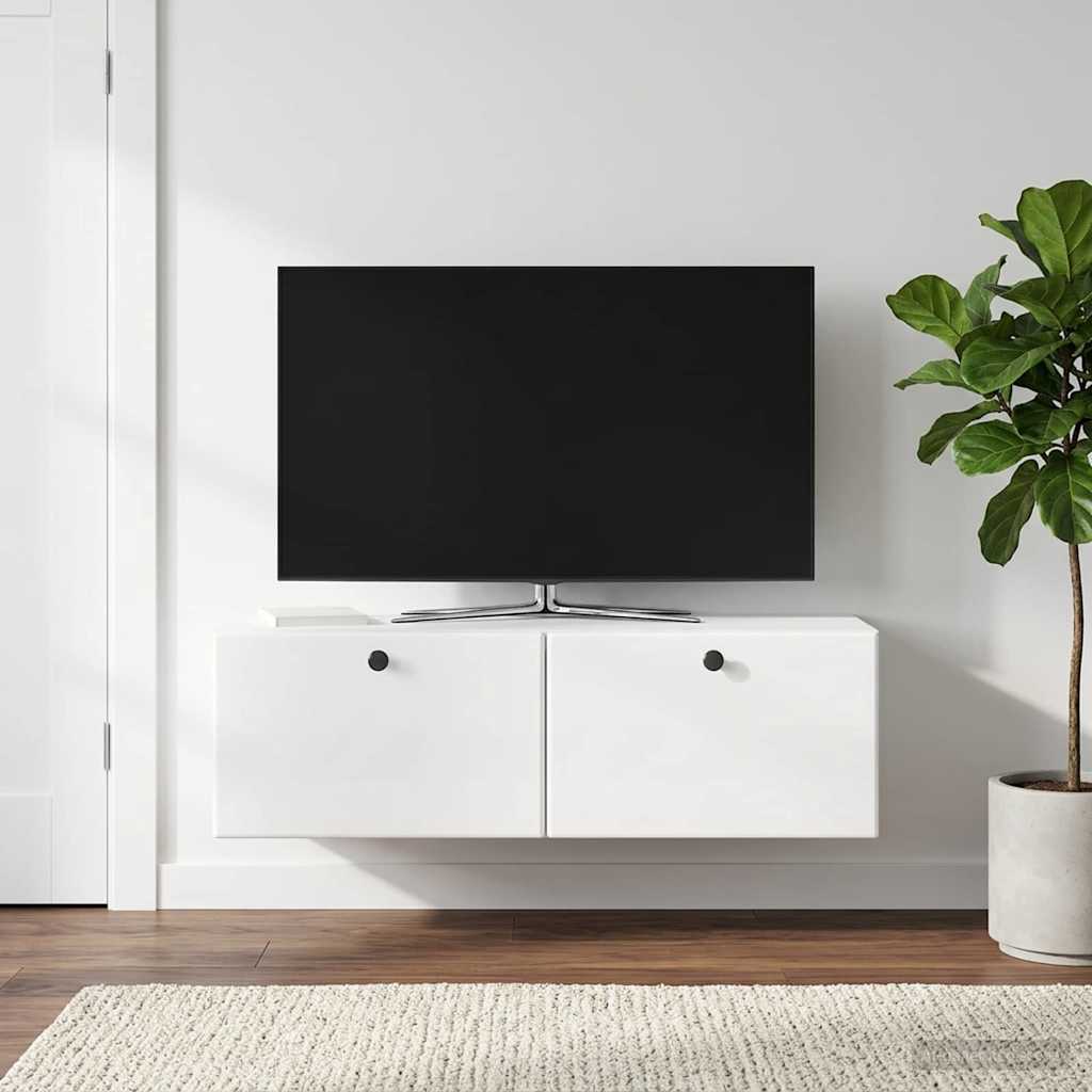 a wall mounted TV cabinet in a modern living room with a plant