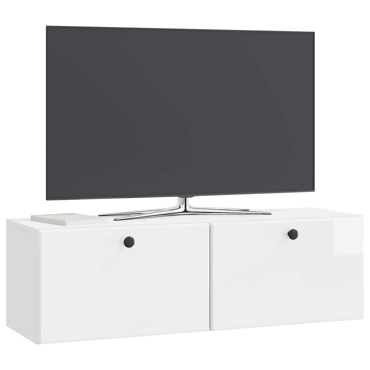 a wall mounted cabinet with a TV on top and a book