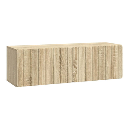 The wall-mounted TV cabinet has a light wood effect finish with vertical panel detailing