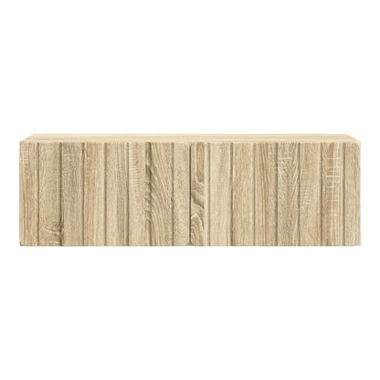 A close-up view of the front of the wall-mounted TV cabinet showing the wood grain effect