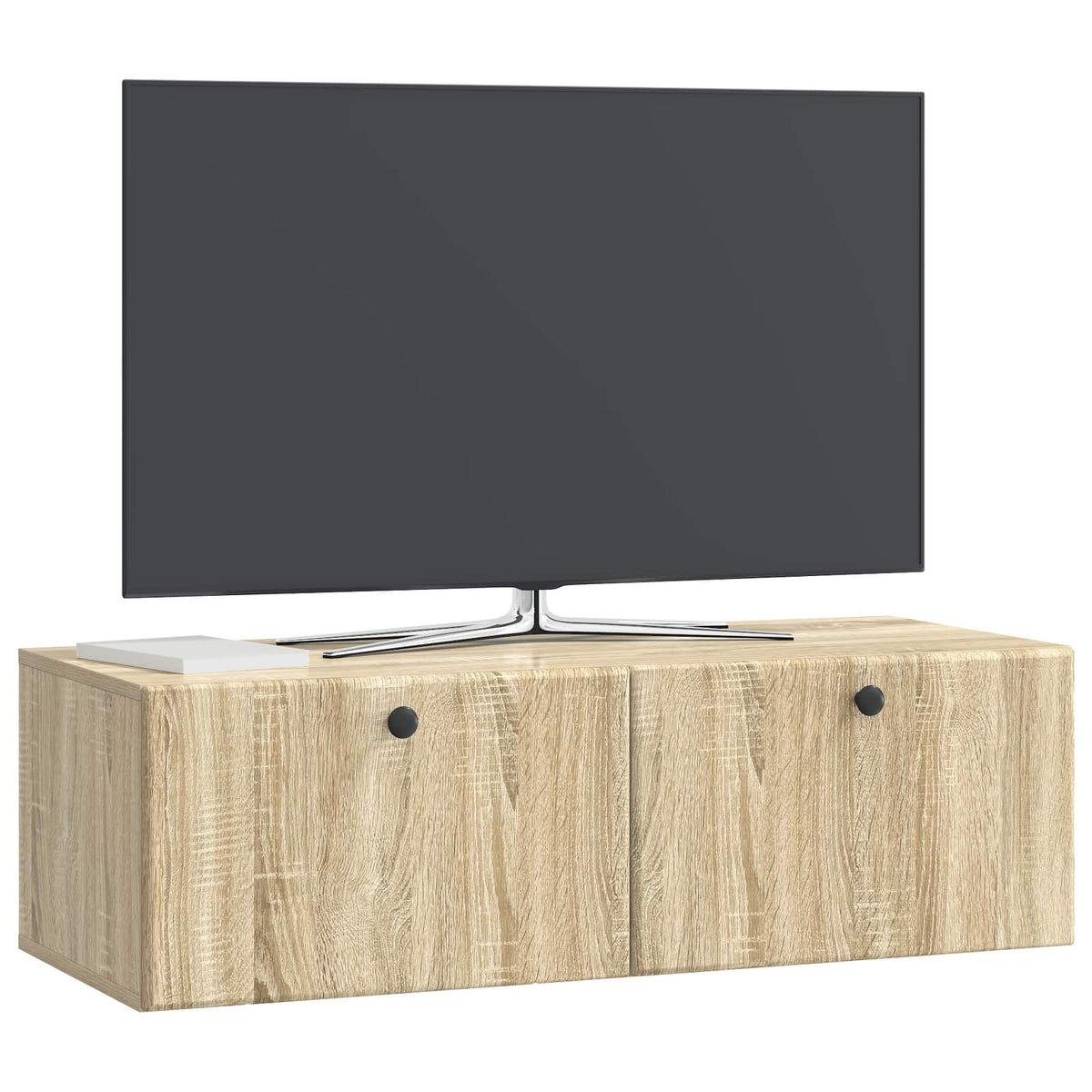 A wall-mounted TV cabinet with a television on top in a studio setting