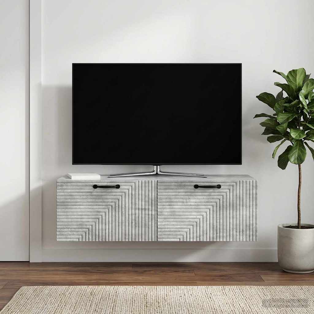 Wall-mounted TV cabinet in a living room setting with a plant and lamp