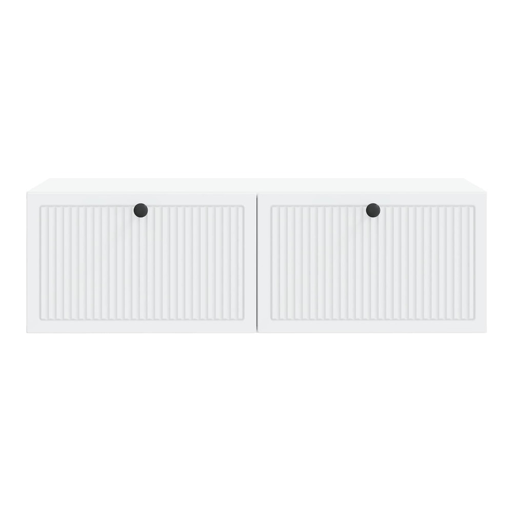 A close-up of the white wall-mounted TV cabinet showing the fluted door detail