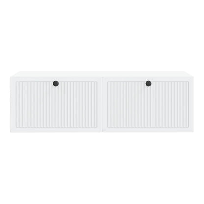 A close-up of the white wall-mounted TV cabinet showing the fluted door detail