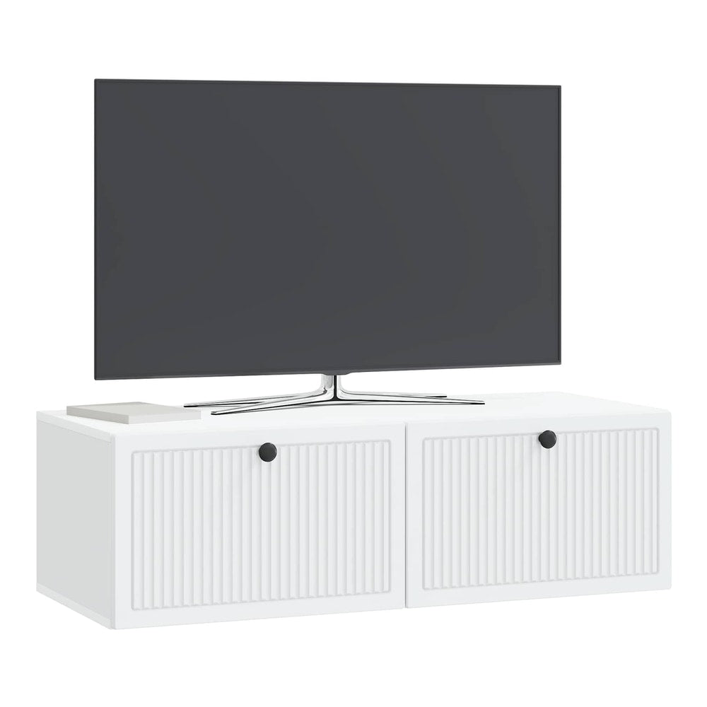 The white wall-mounted cabinet for a television has two doors with ribbed fronts