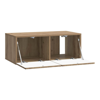 The TV cabinet with both front doors open to reveal the interior storage compartments