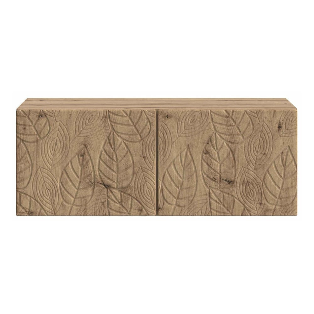 The TV cabinet showing the detailed leaf carvings on the two closed front doors
