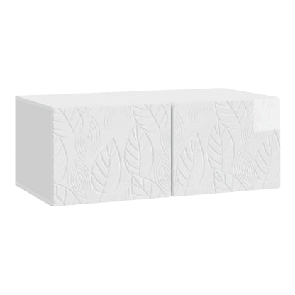 A white wall-mounted TV cabinet with a leaf pattern on its doors