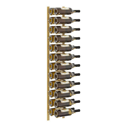A gold iron wall mounted wine rack holding several bottles of wine
