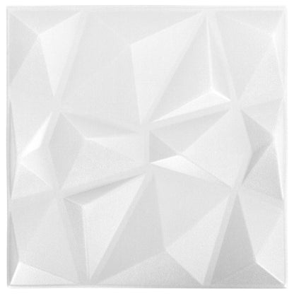 A single white geometric wall panel with a faceted diamond design shown from a slight angle