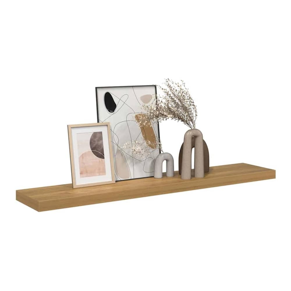 Brown wooden wall shelf with decorative items on top