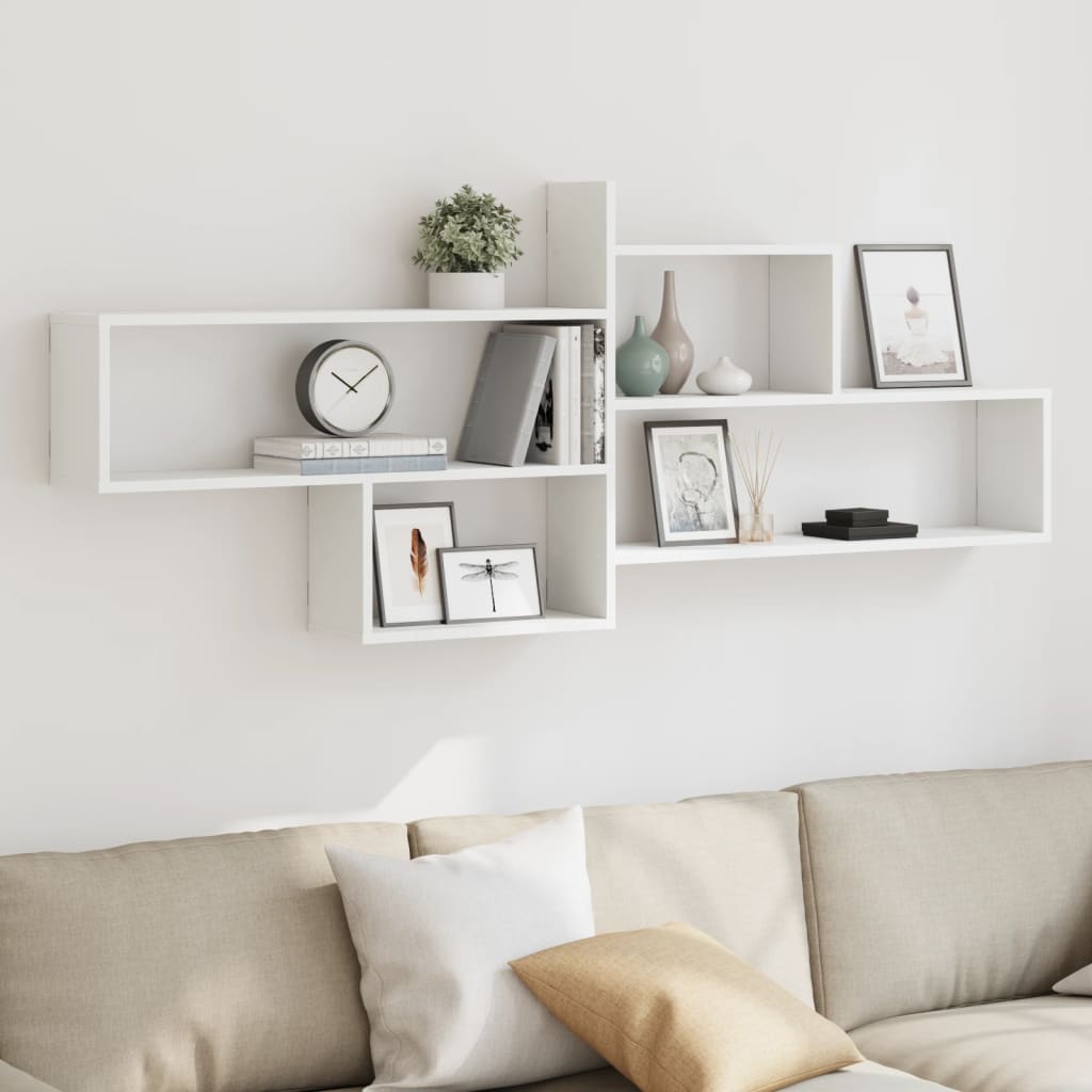 vidaXL Wall Shelf White Engineered Wood displayed on a wall above a sofa