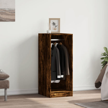 The wardrobe in a bedroom setting with clothes hanging inside