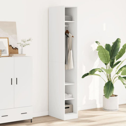 vidaXL Wardrobe White Engineered Wood standing in a room next to a cabinet and a plant