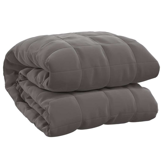 The grey weighted blanket folded neatly on a plain white background