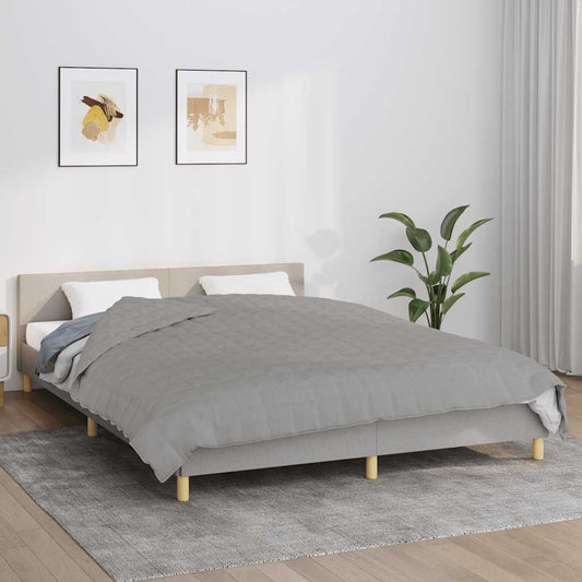 vidaXL Weighted Blanket Grey 13 kg laid out on a bed with pillows and a plant