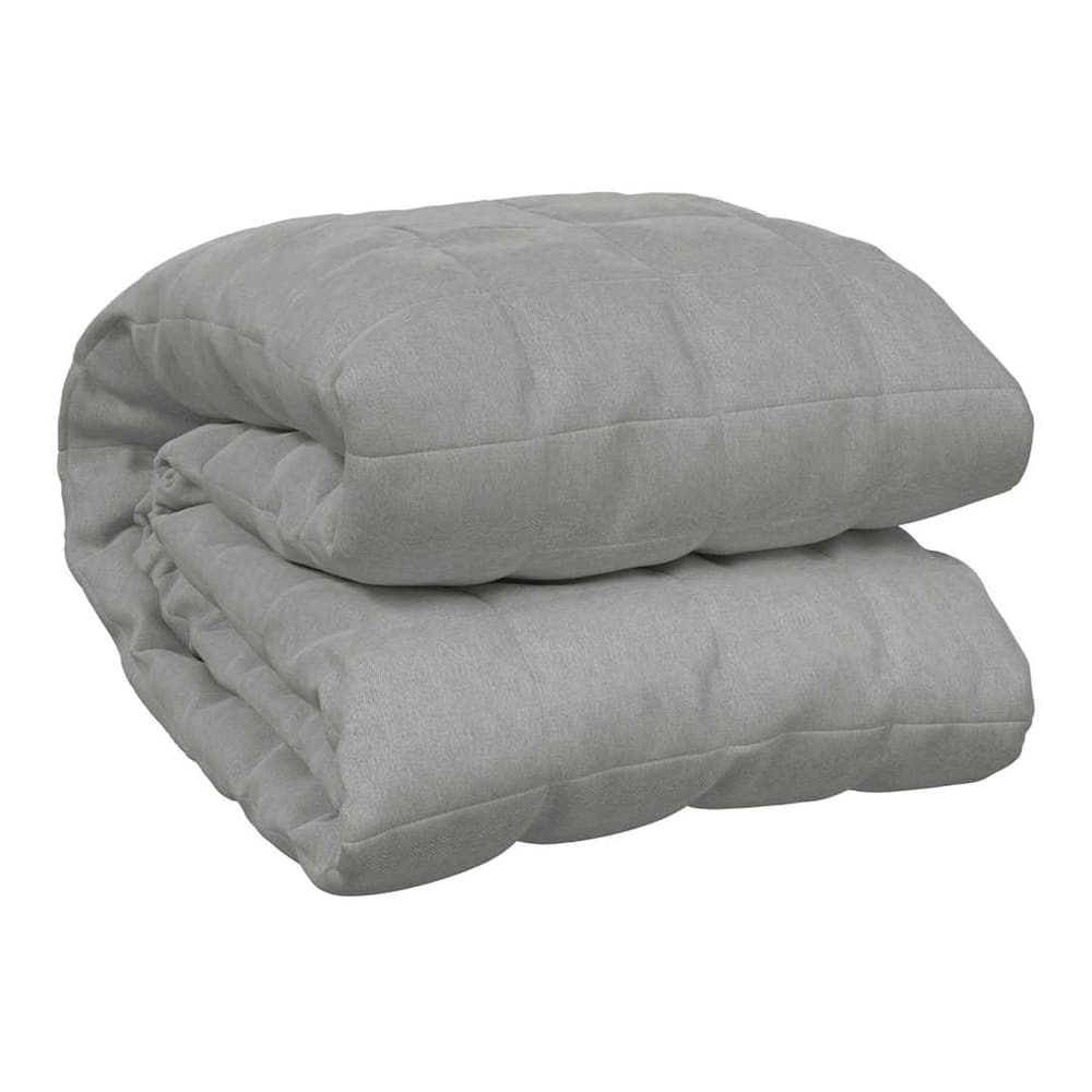 The grey weighted blanket folded neatly on a plain background