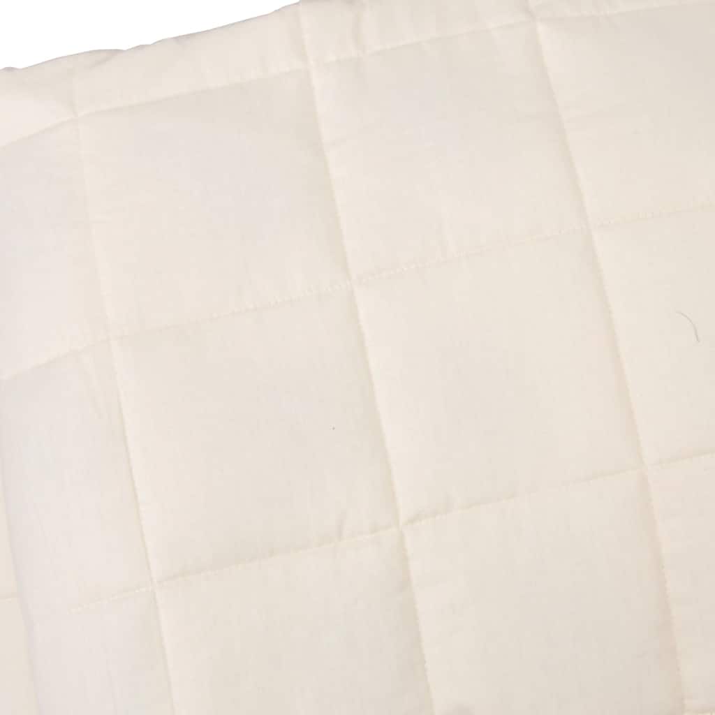 Close-up of the light cream weighted blanket fabric and stitching detail