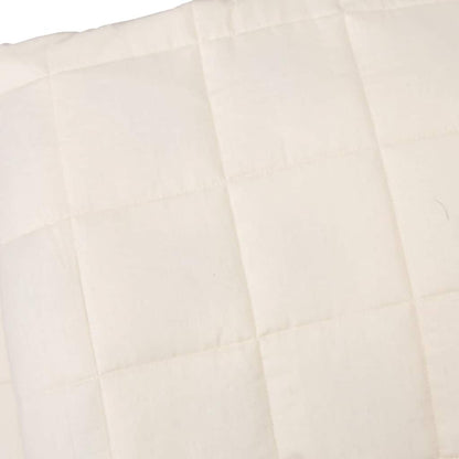 Close-up of the light cream weighted blanket fabric and stitching detail