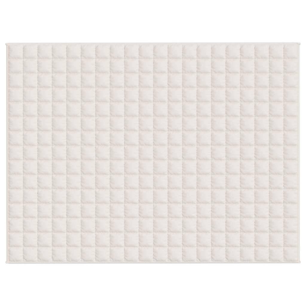 The top of a light cream weighted blanket, showing a grid pattern of squares