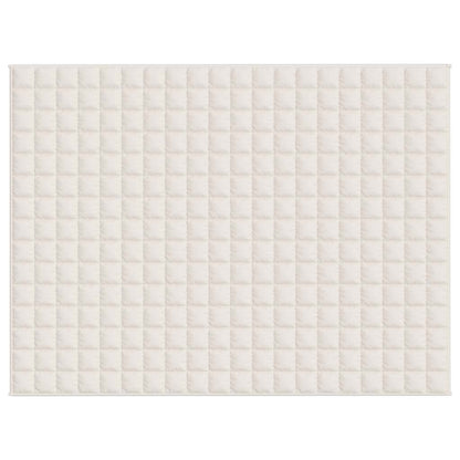 The top of a light cream weighted blanket, showing a grid pattern of squares