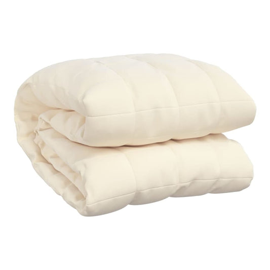 A folded weighted blanket in light cream fabric