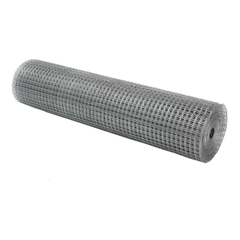 A large roll of welded wire mesh fencing lying on its side