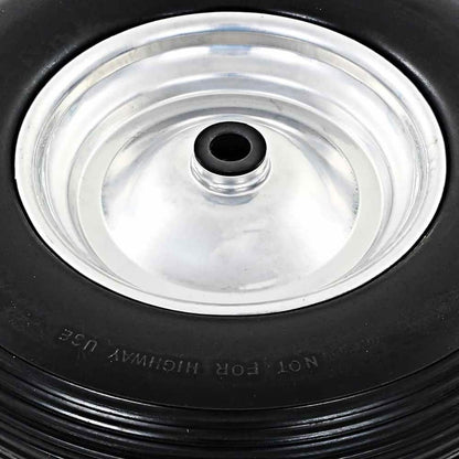 Close up of the silver metal rim and black centre of a wheelbarrow wheel