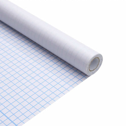 Close-up of the frosted grey PVC window film roll showing a grid pattern on the backing paper