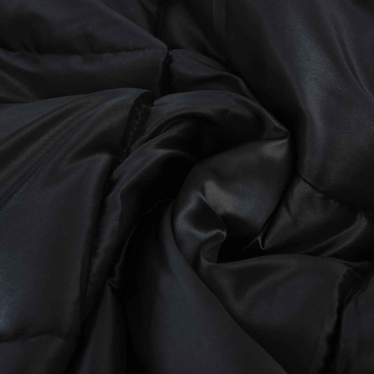 soft folds of the black winter duvet showing its filling