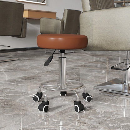 The brown PU leather rolling stool in a salon setting with chairs