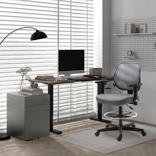 The grey three-drawer office storage unit under a desk with a computer and office chair
