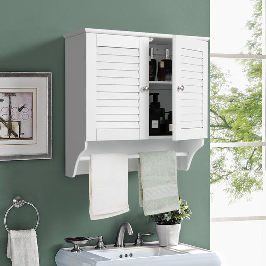 The wall cabinet is shown above a sink with towels and toiletries inside
