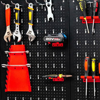 Close-up of the metal pegboard tool storage kit showing various tools and holders