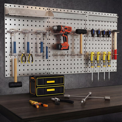 The garage storage system holding various hand tools above a dark wooden workbench