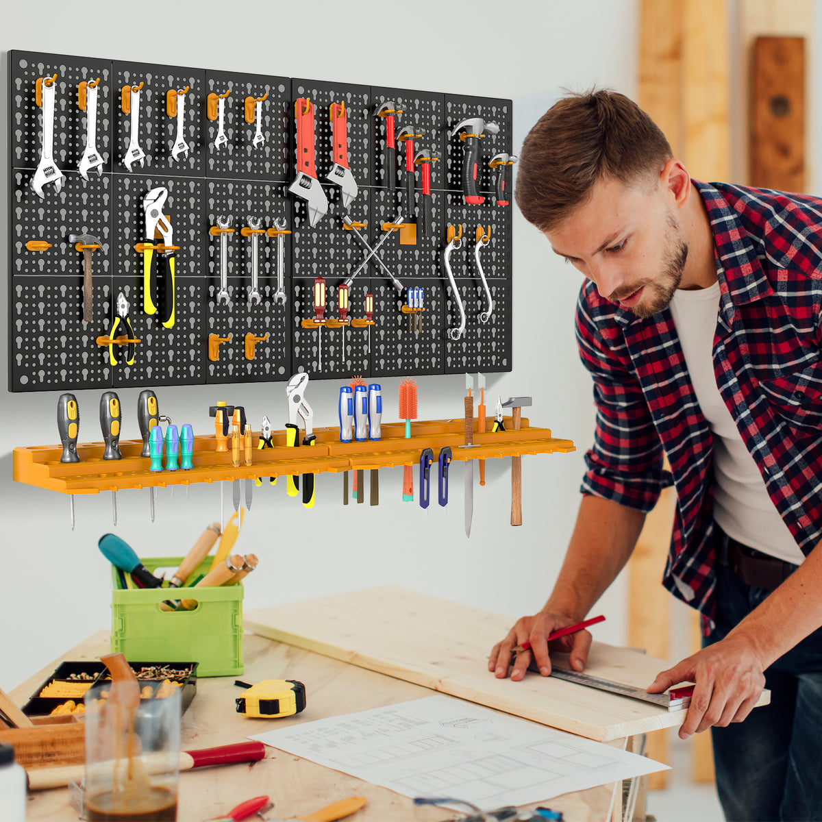 The garage storage organiser with tools displayed on pegboard panels and orange shelves