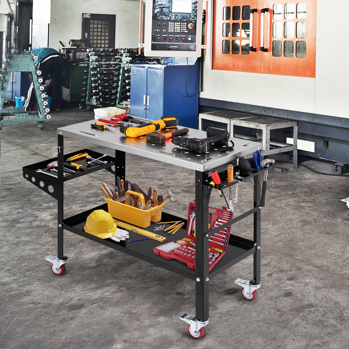 The garage workbench loaded with various power tools and equipment inside a busy workshop