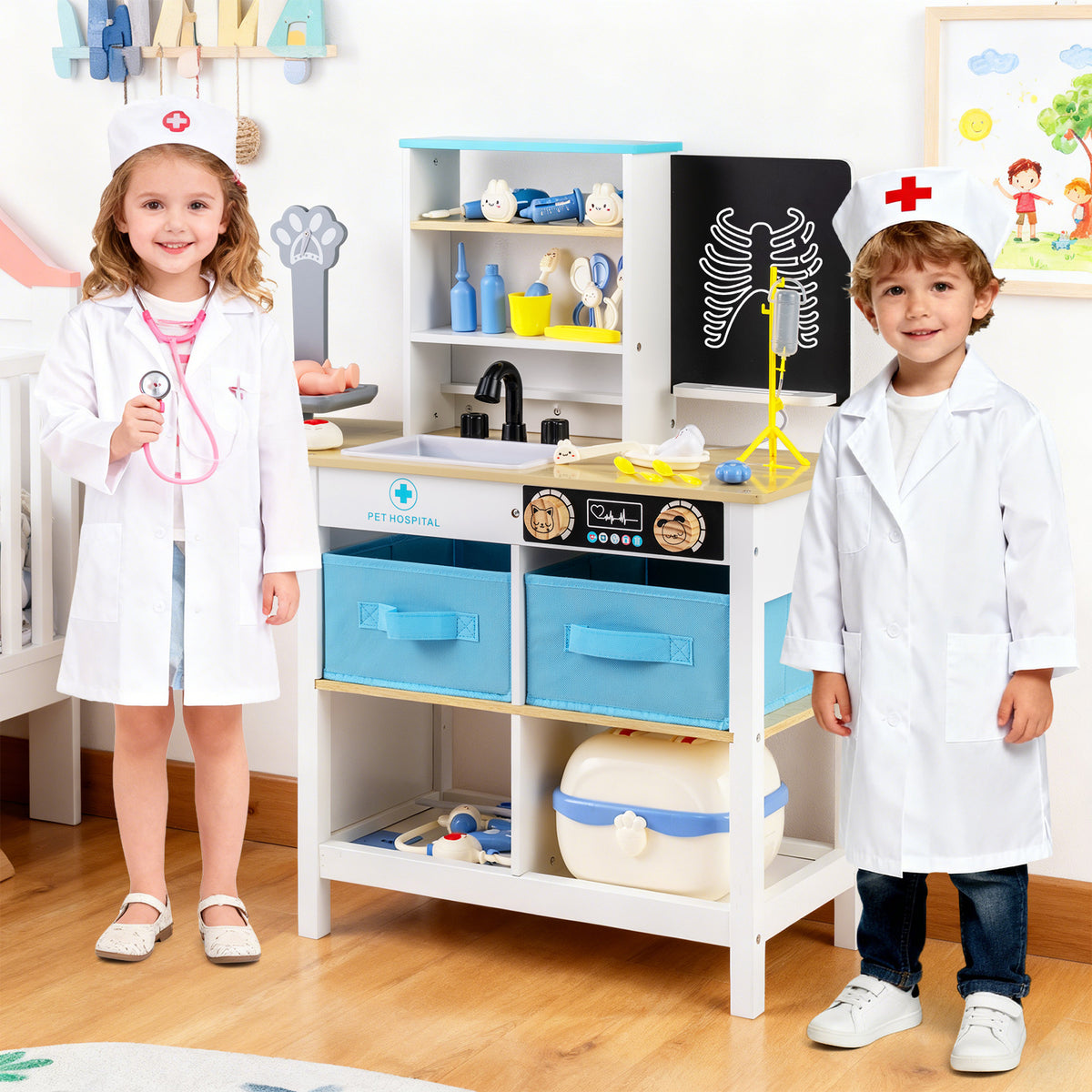 Two children dressed as doctors playing with the wooden medical centre toy set