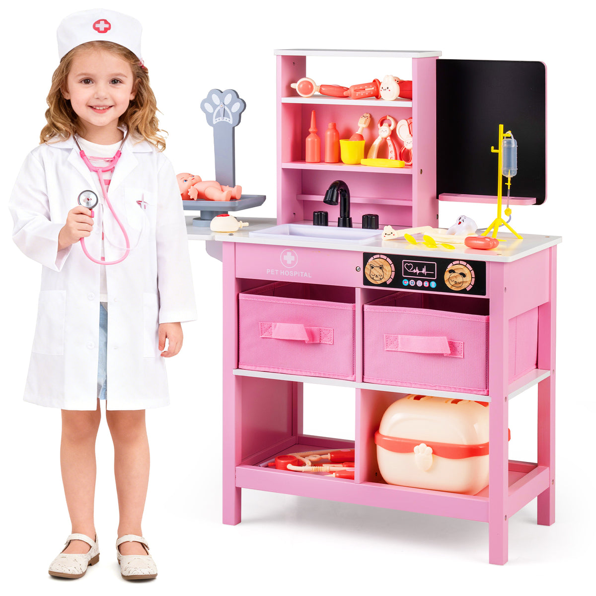 A young girl in a doctor costume standing beside the pink medical play station