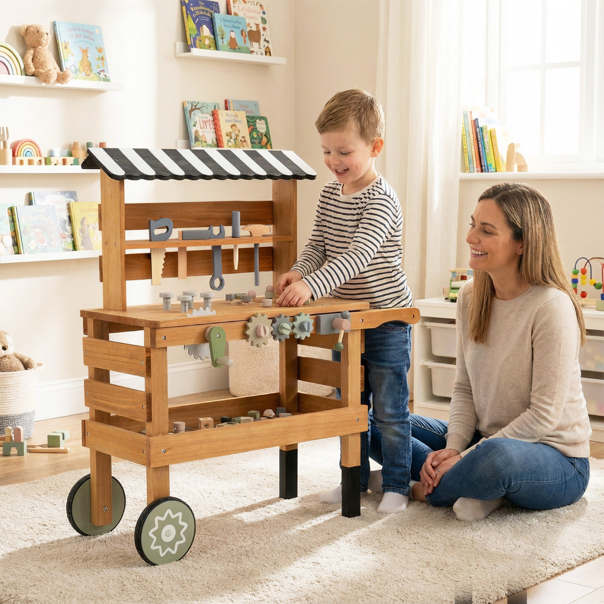 A mother and child interacting with the wooden play kitchen set indoors