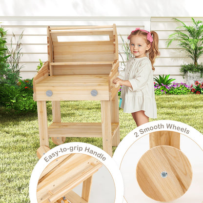 The play kitchen set being pushed by a child with close-ups of the handle and wheels