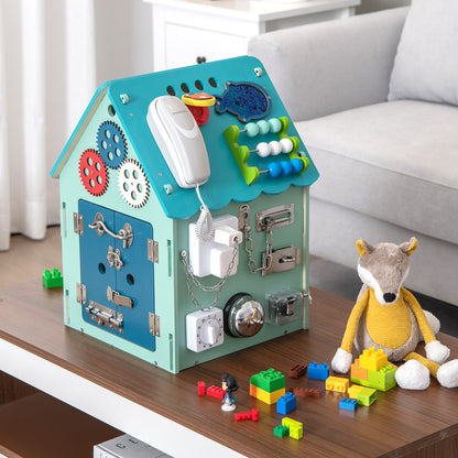 The learning toy placed on a wooden table next to a stuffed fox toy and colourful building blocks